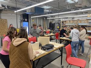 students working in woodshop